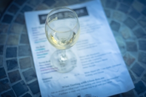 Wine tasting concept with glass of dry white wine and tasting me - Songbird RV Park 2
